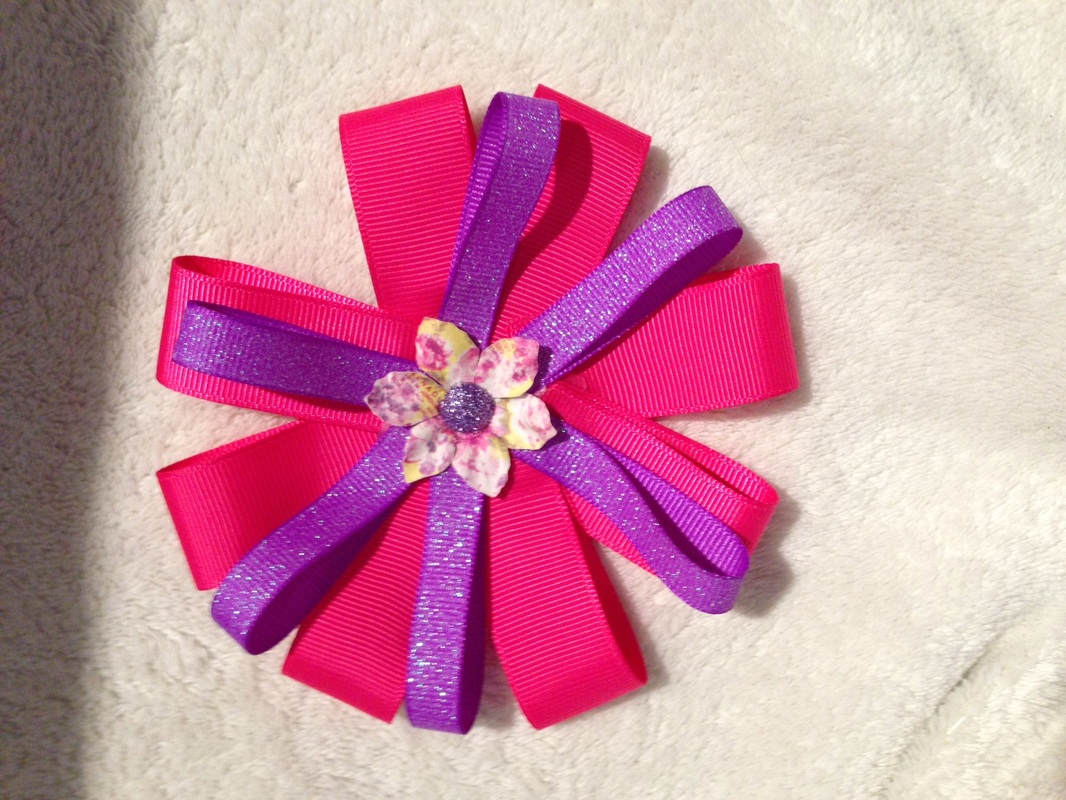 pink and purple circle bow with a center flower and purple sparkle ...